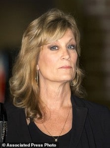 FILE - In this Friday, Dec. 5, 2014 file photo, Judy Huth appears at a press conference with attorney Gloria Allred, not shown, outside the Los Angeles Police Department's Wilshire Division station in Los Angeles. A lawyer for Huth who is suing Bill Cosby alleging the comedian s*xually abused her when she was 15 years old says he has interviewed two witnesses who corroborate her story. Attorney Marc Strecker wrote in a sworn declaration filed Friday, Dec. 12, 2014, in Los Angeles Superior Court that he also has reviewed photographs of his client with Cosby at the Playboy Mansion when she was age 15. (AP Photo/Anthony McCartney, File)