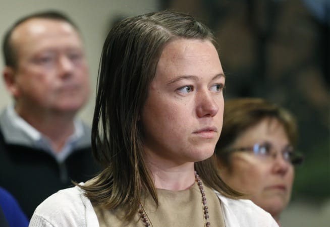 Michelle Wilkins, center, stands with her father Mark and mother Wendy, as Wilkins speaks with members of the media following the sentencing hearing for Dynel Lane, who was given 100 years in prison for cutting the nearly 8-month-old fetus from Wilkins's womb in 2015, at the Boulder County Justice Center, in Boulder, Colo., Friday, April 29, 2016.  (AP Photo/Brennan Linsley)