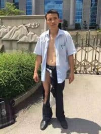 How This Chinese Lawyer Made His Case Despite His Clothes Being Ripped Off