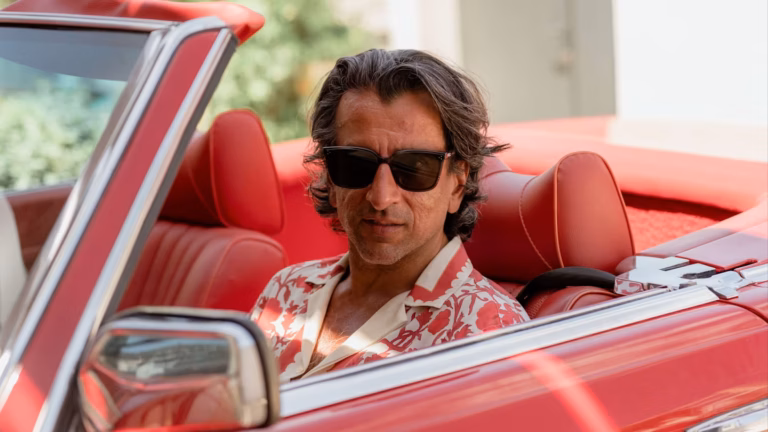 The Consigliere in the Red Mercedes –  Neel Sachdev, Big Law’s Leading Man