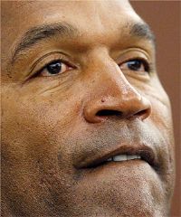 O.J. Simpson was taken into custody in Florida on allegations that he violated terms of his bail by trying to talk a co-defendant out of cooperating in a Las Vegas armed robbery case, court documents say.