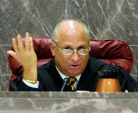 In what amounts to a whistle-blower complaint, ex-Broward Judge Jay Spechler is suing his former boss over a ''bogus'' demotion, and wants his spot back on the bench, according to the civil defamation lawsuit.